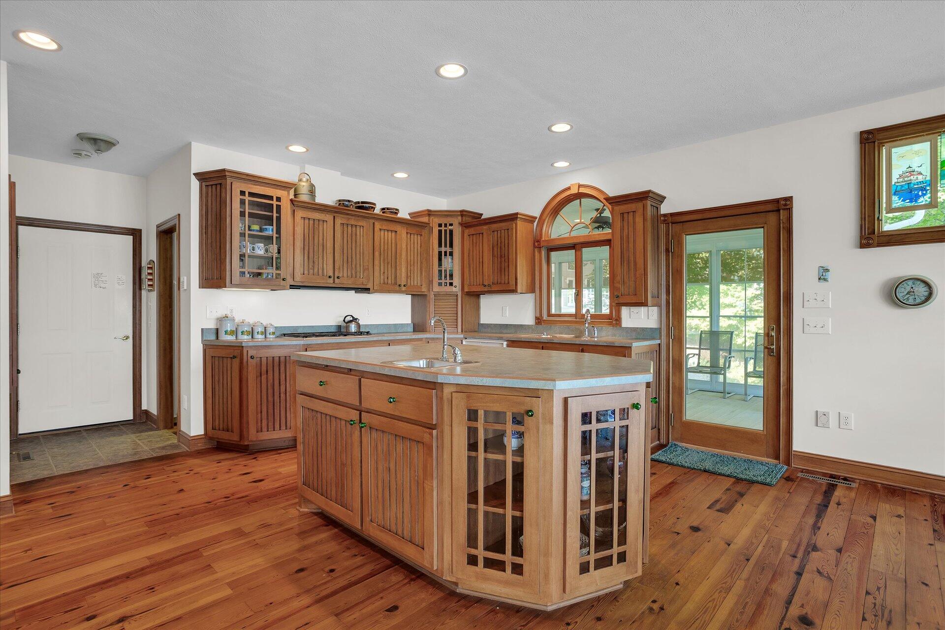 51 Spinnaker Drive Union Hall, VA 24176 - Photo 16 of 58 a kitchen with stainless steel appliances granite countertop a kitchen island hardwood floor sink and wooden cabinets