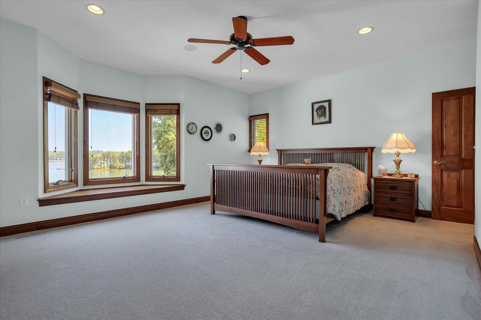 51 Spinnaker Drive Union Hall, VA 24176 - Photo 21 of 58 a bedroom with a bed chandelier and window