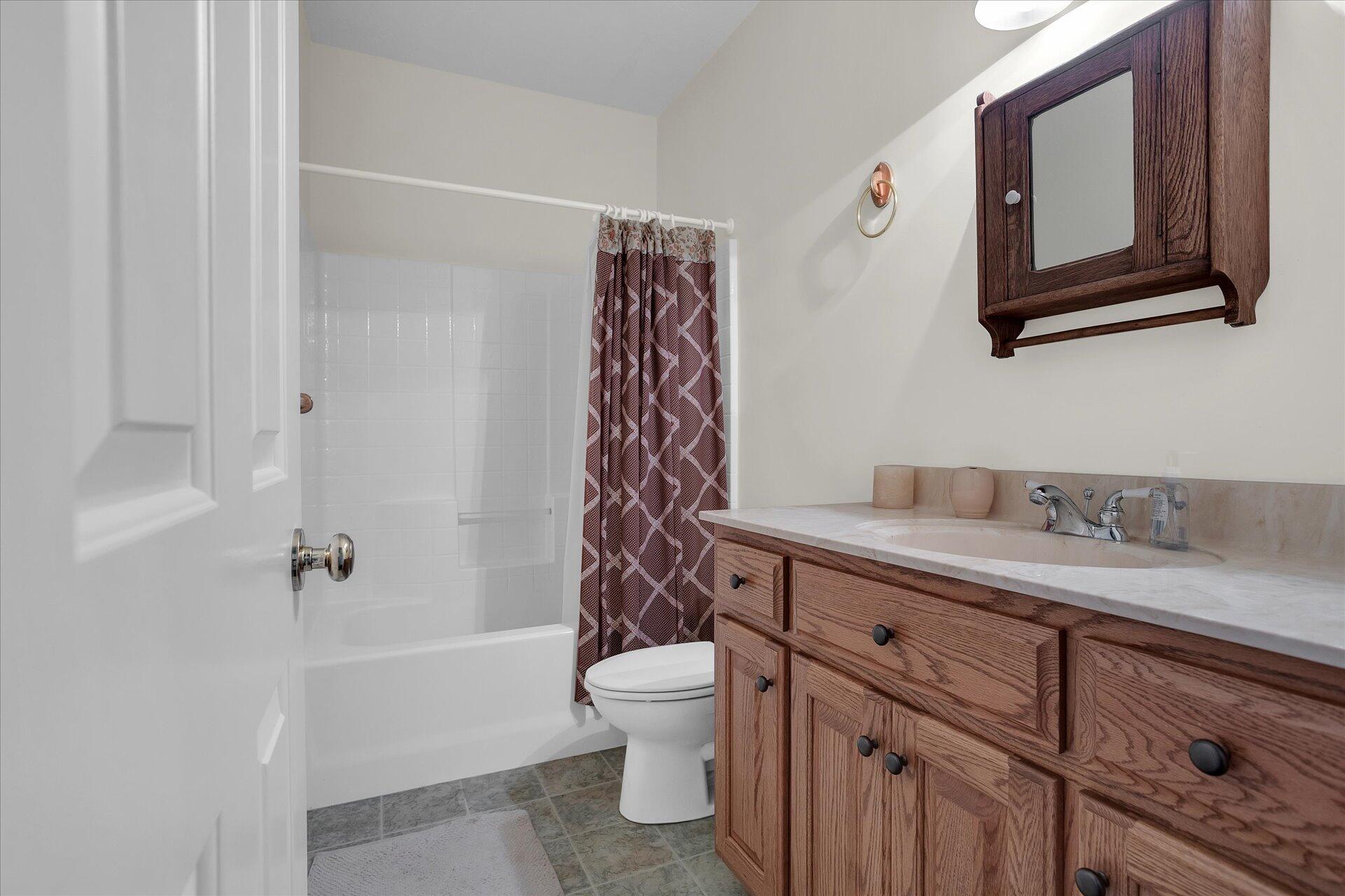 51 Spinnaker Drive Union Hall, VA 24176 - Photo 38 of 58 a bathroom with a granite countertop sink a toilet and a mirror