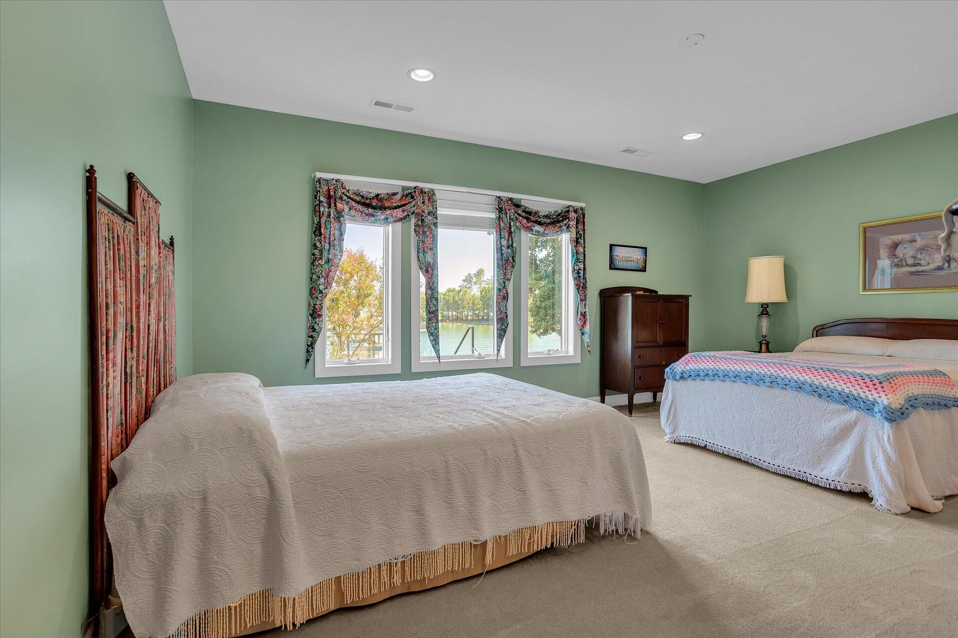 51 Spinnaker Drive Union Hall, VA 24176 - Photo 39 of 58 a bedroom with a bed and a large window