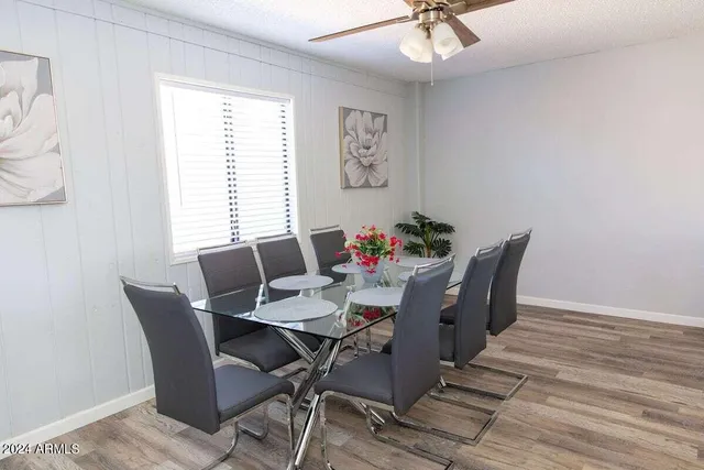 a view of a dining room with furniture window and wooden floor
