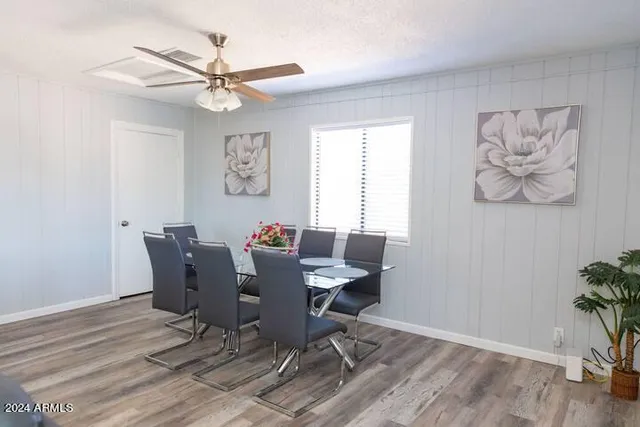 a view of a dining room with furniture window and wooden floor