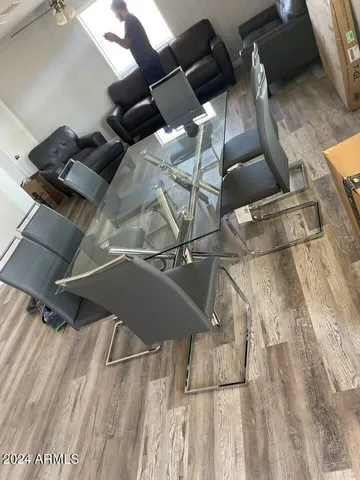 a view of a dining room with furniture window and wooden floor