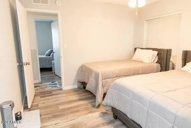 a bathroom with a granite countertop toilet sink and shower