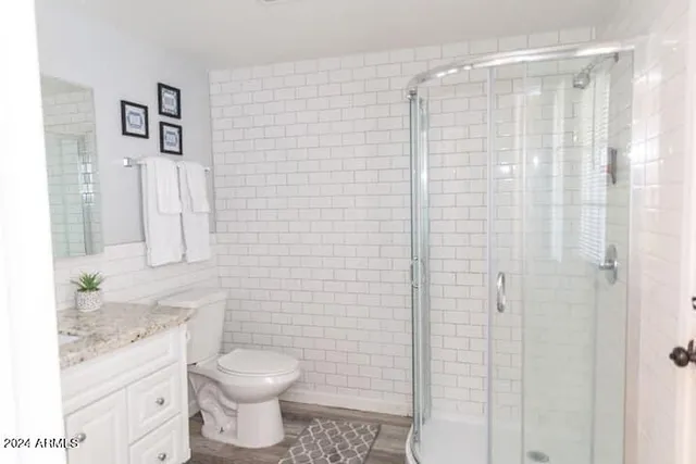 a bedroom with double bed and a night stand