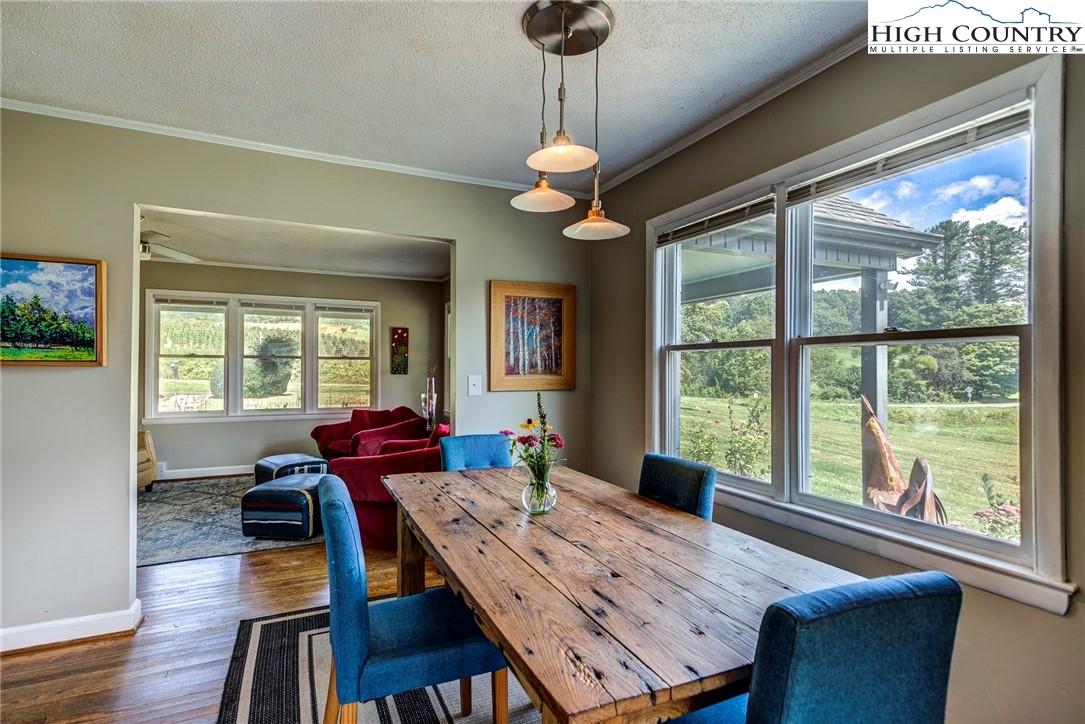 1046 J E Gentry Road Laurel Springs, NC 28644 - Photo 17 of 49 a view of a dining room with furniture window and wooden floor