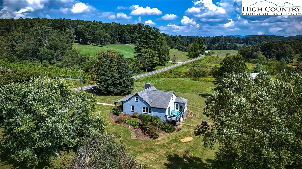 1046 J E Gentry Road Laurel Springs, NC 28644 - Photo 44 of 49 a view of a house with a yard