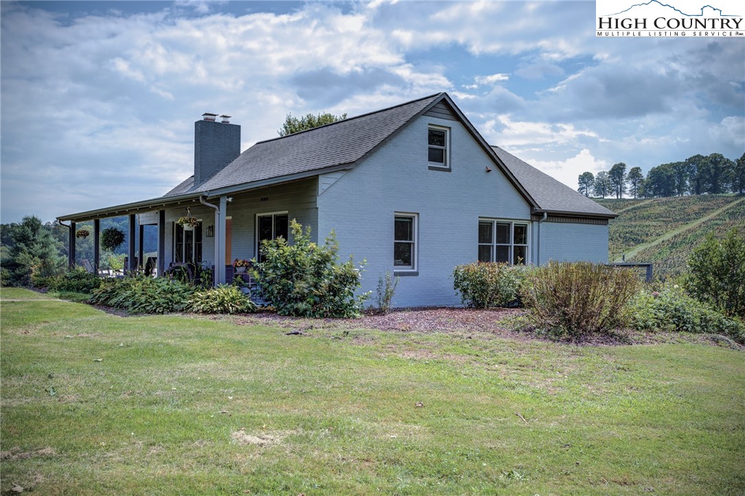 1046 J E Gentry Road Laurel Springs, NC 28644 - Photo 7 of 49 a front view of a house with a yard