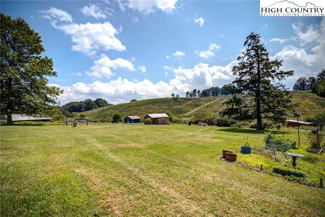 a view of a chairs and table in the balcony