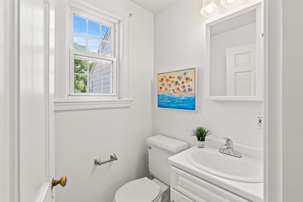 6 Shetland Road Marblehead, MA 01945 - Photo 16 of 39 a white toilet sitting next to a bathroom sink