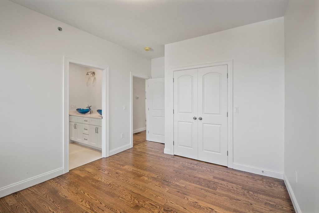 5 Squire Drive Wilbraham, MA 01095 - Photo 13 of 42 wooden floor with white cabinet