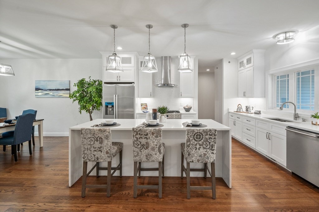 5 Squire Drive Wilbraham, MA 01095 - Photo 20 of 42 a dining hall with stainless steel appliances kitchen island granite countertop a dining table chairs and sink