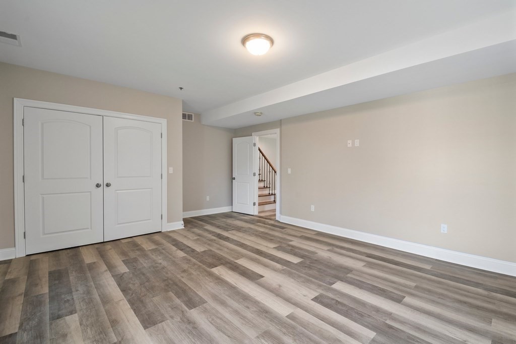 5 Squire Drive Wilbraham, MA 01095 - Photo 30 of 42 a view of an empty room with wooden floor