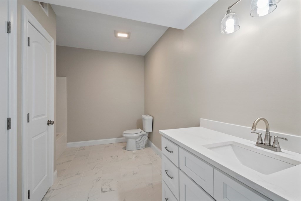 5 Squire Drive Wilbraham, MA 01095 - Photo 32 of 42 a bathroom with a sink and a toilet