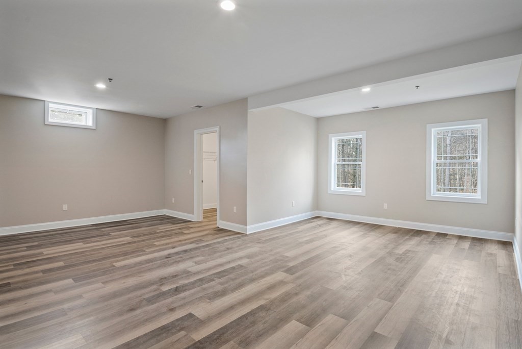 5 Squire Drive Wilbraham, MA 01095 - Photo 33 of 42 a view of an empty room with wooden floor and a window