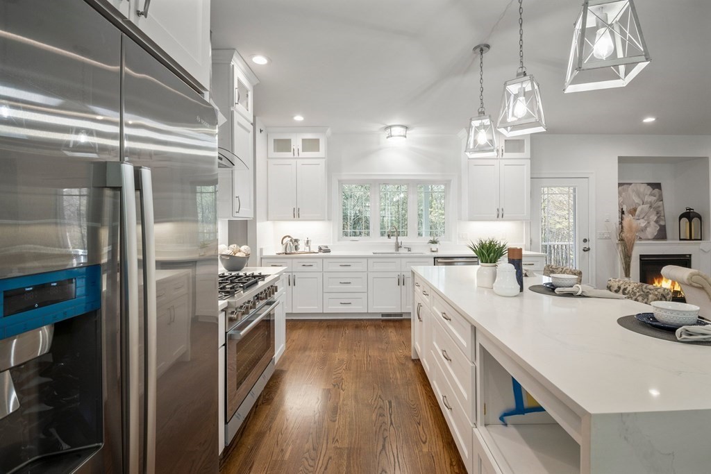 5 Squire Drive Wilbraham, MA 01095 - Photo 6 of 42 a kitchen with stainless steel appliances a sink stove and refrigerator
