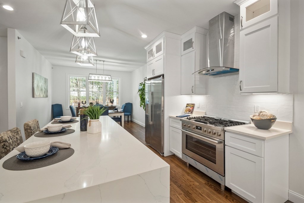5 Squire Drive Wilbraham, MA 01095 - Photo 7 of 42 a kitchen with stainless steel appliances a stove a sink and cabinets