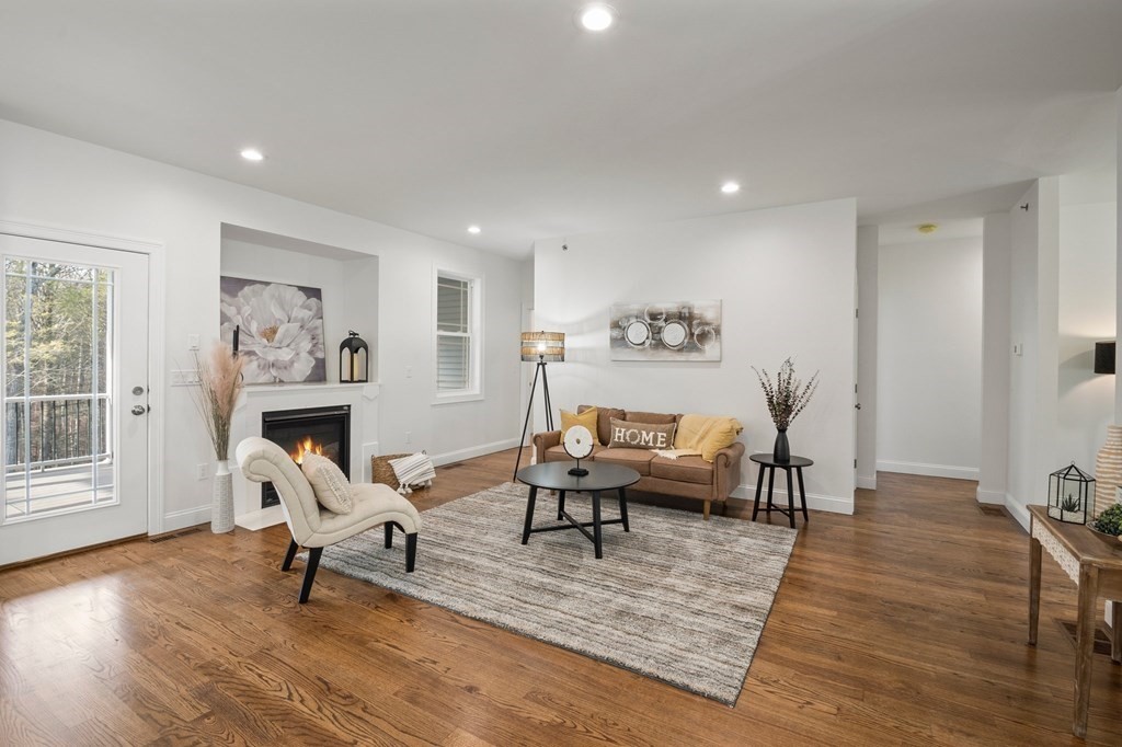 5 Squire Drive Wilbraham, MA 01095 - Photo 9 of 42 a living room with furniture and a chandelier