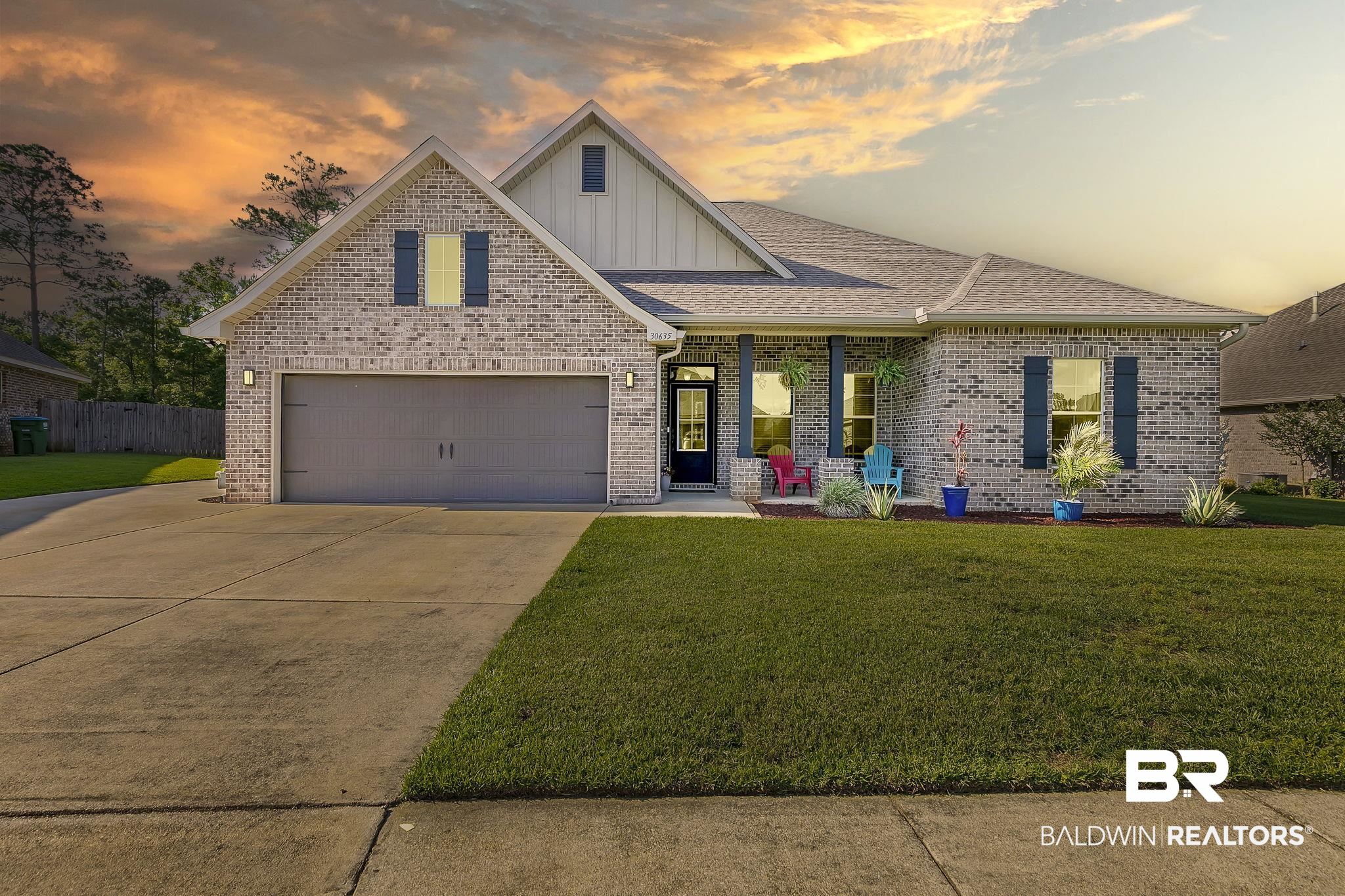 30635 Drayton Court Daphne, AL 36527 - Photo 2 of 51 View of front of home with board and batten siding, brick siding, driveway, and covered porch