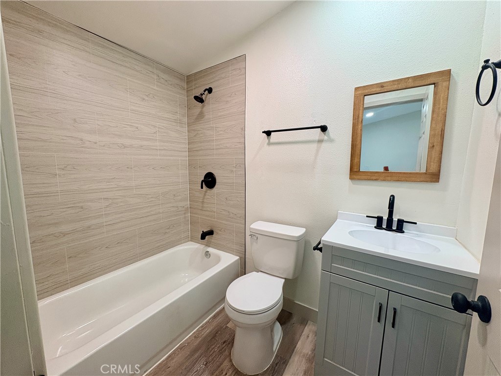 4585 Hawthorne Street, Unit B Montclair, CA 91763 - Photo 5 of 6 a bathroom with a sink a toilet and shower