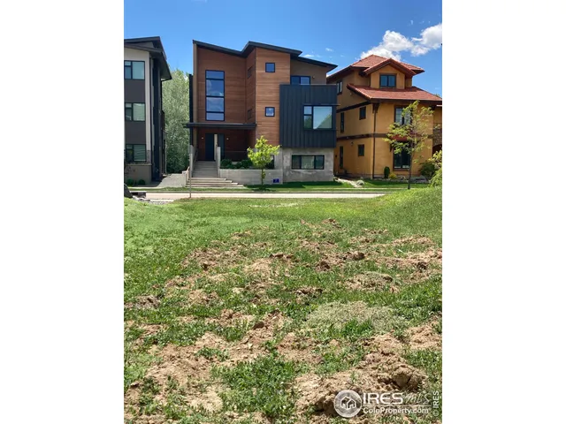 a house view with swimming pool in front of it