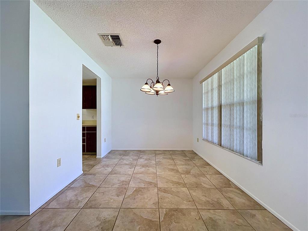 9319 Trowbridge Court New Port Richey, FL 34655 - Photo 24 of 78 a view of an empty room with a window