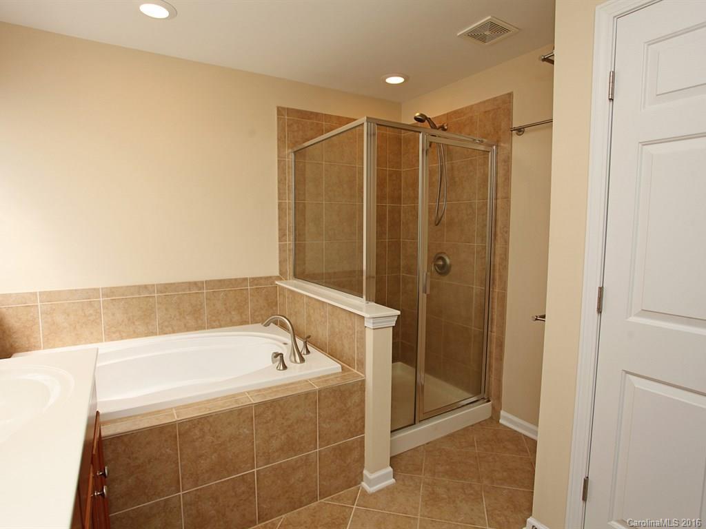 3442 Richard's Crossing Fort Mill, SC 29708 - Photo 22 of 24 a bathroom with a bathtub and a shower