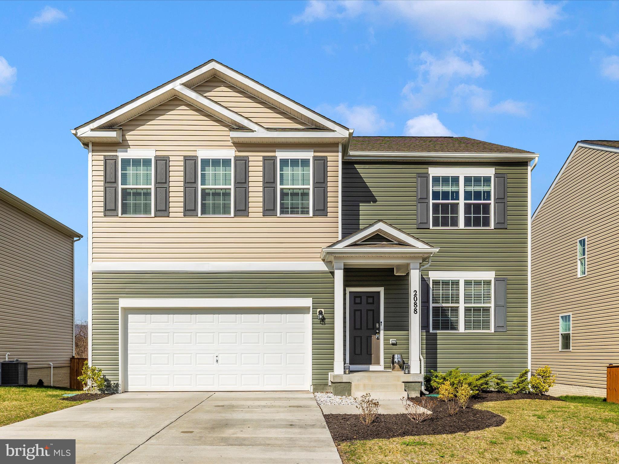 2088 Pomona Way Frederick, MD 21702 - Photo 1 of 55 a front view of a house with a yard