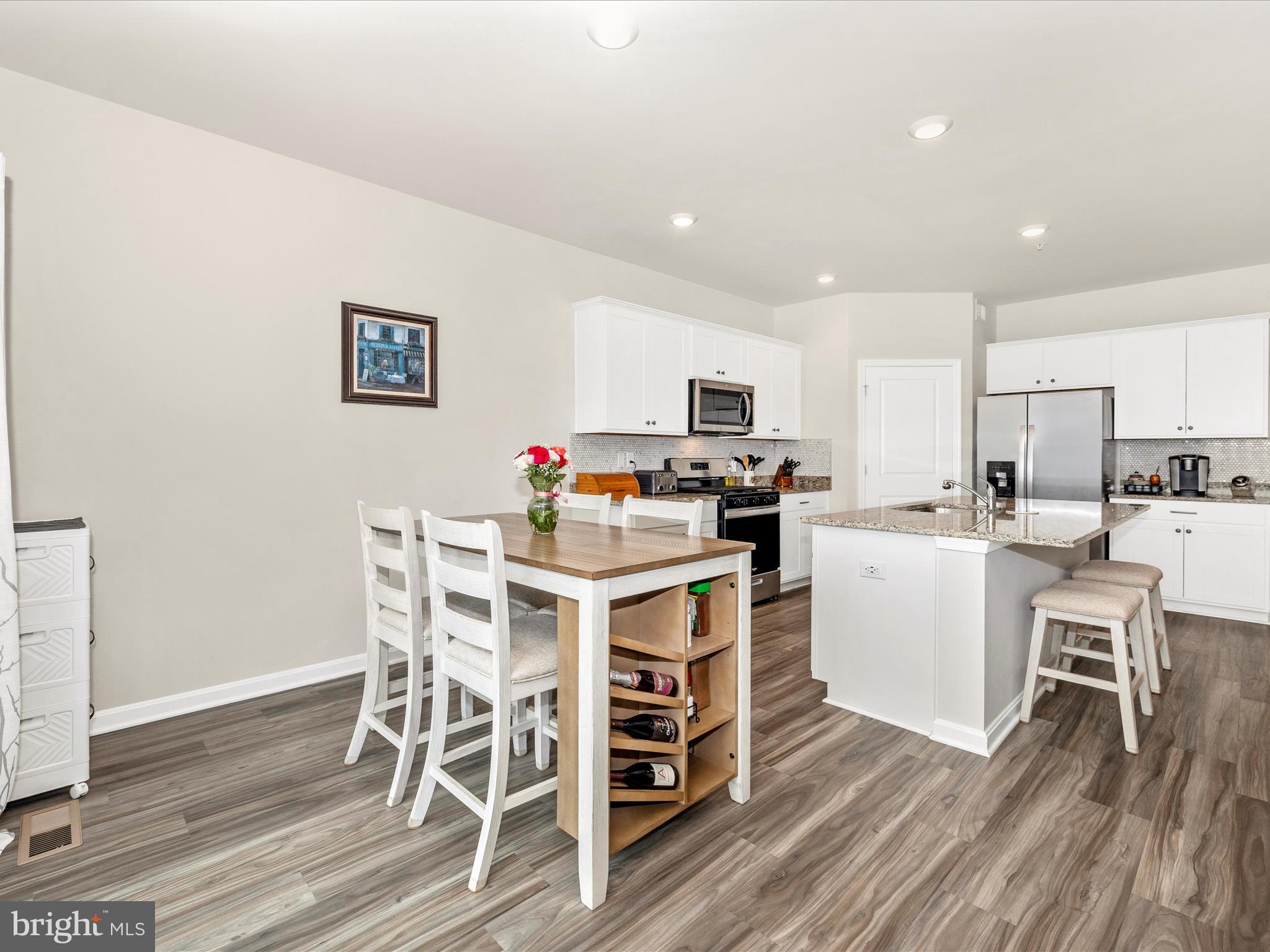 2088 Pomona Way Frederick, MD 21702 - Photo 15 of 55 a dining room with furniture and wooden floor