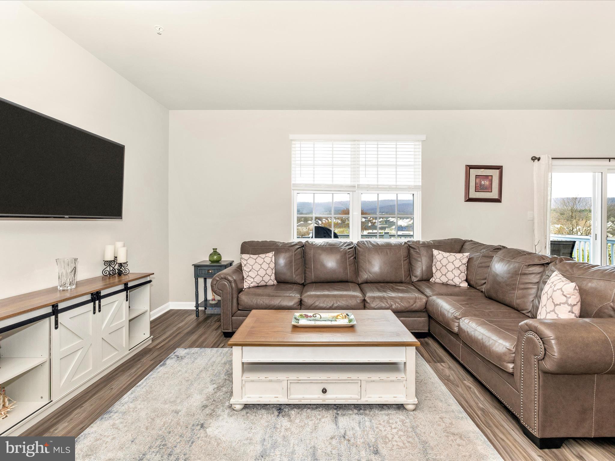2088 Pomona Way Frederick, MD 21702 - Photo 16 of 55 a living room with furniture and a flat screen tv
