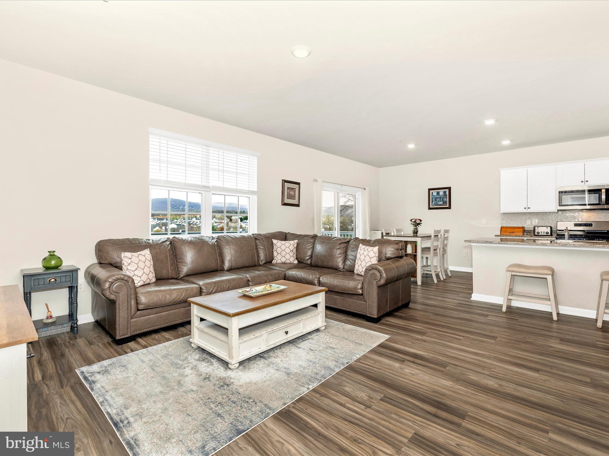 2088 Pomona Way Frederick, MD 21702 - Photo 17 of 55 a living room with furniture and kitchen view with wooden floor