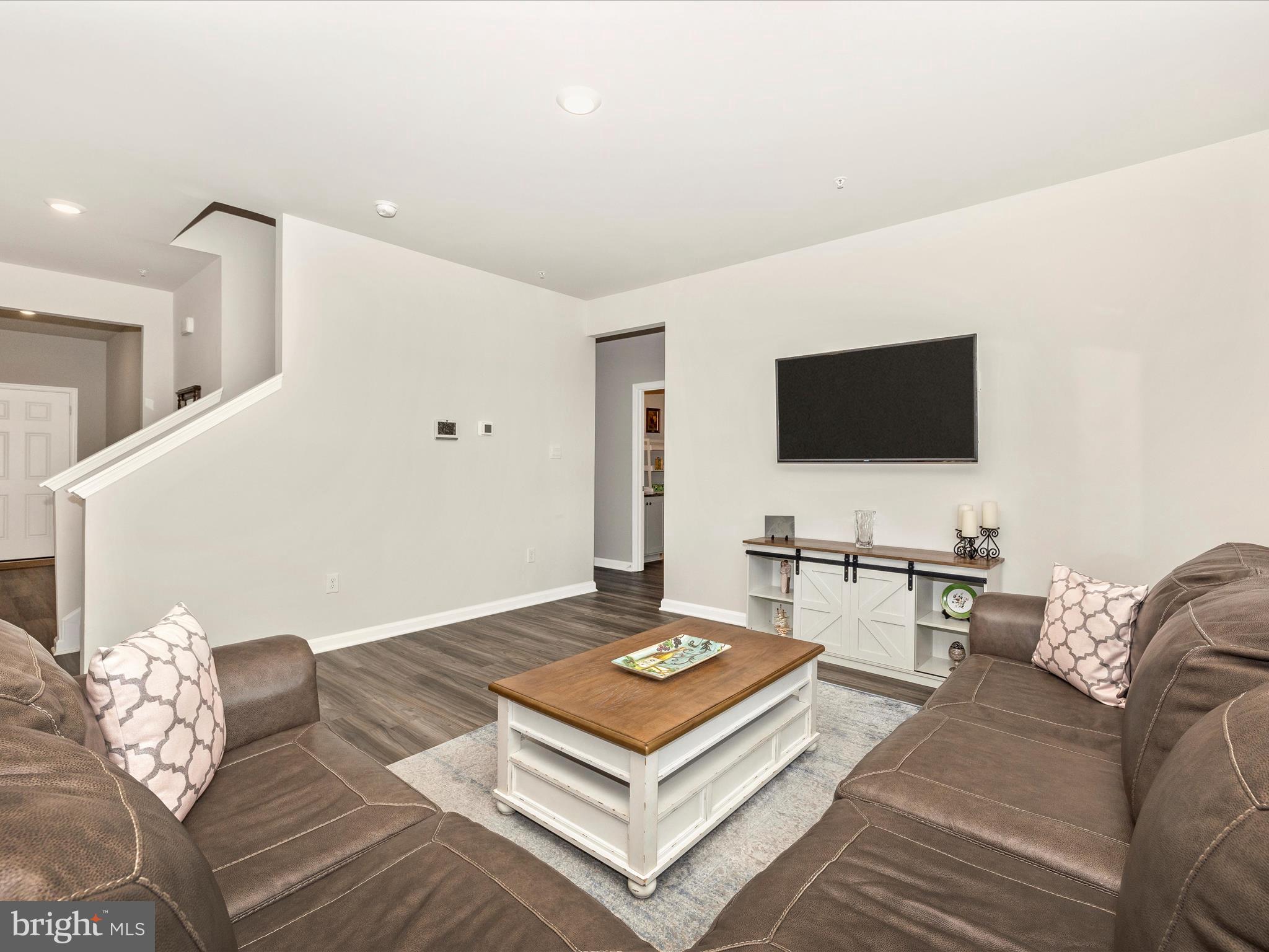 2088 Pomona Way Frederick, MD 21702 - Photo 18 of 55 a living room with furniture and a flat screen tv