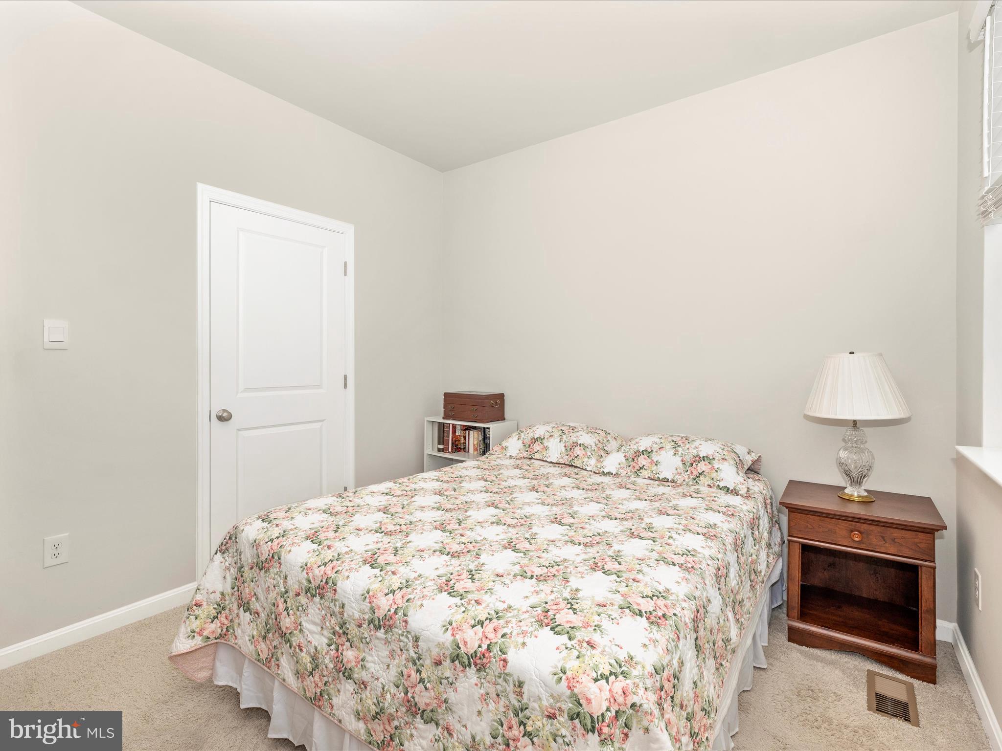 2088 Pomona Way Frederick, MD 21702 - Photo 20 of 55 a bedroom with a bed and a lamp