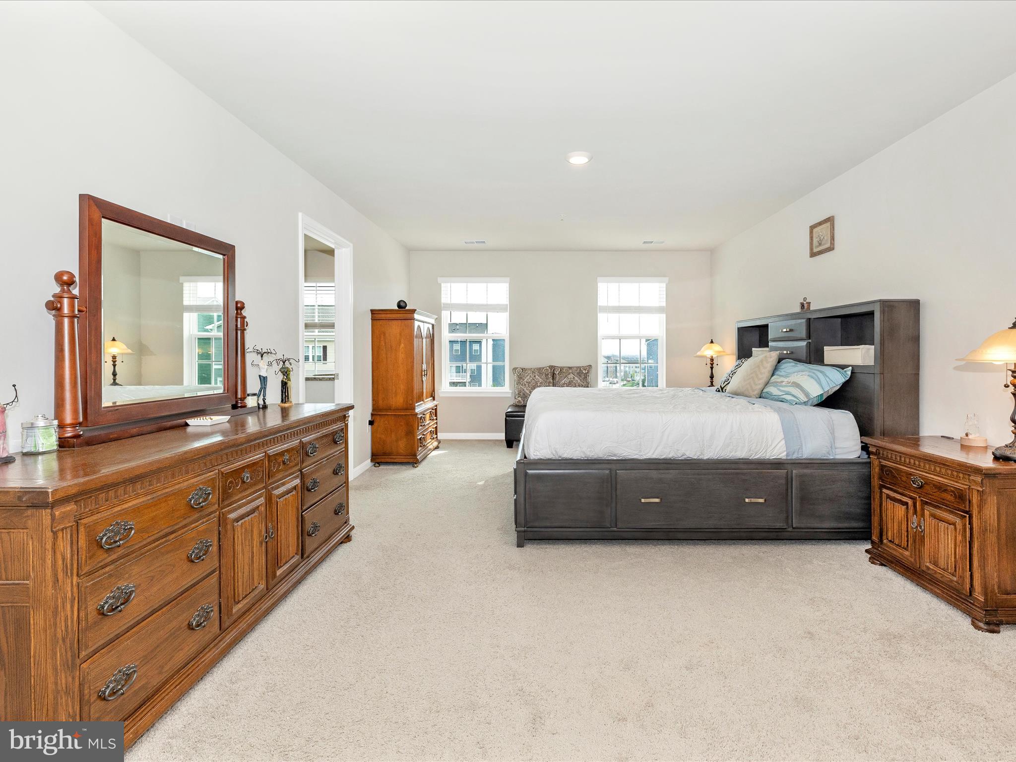 2088 Pomona Way Frederick, MD 21702 - Photo 22 of 55 a spacious bedroom with a large bed and a dresser