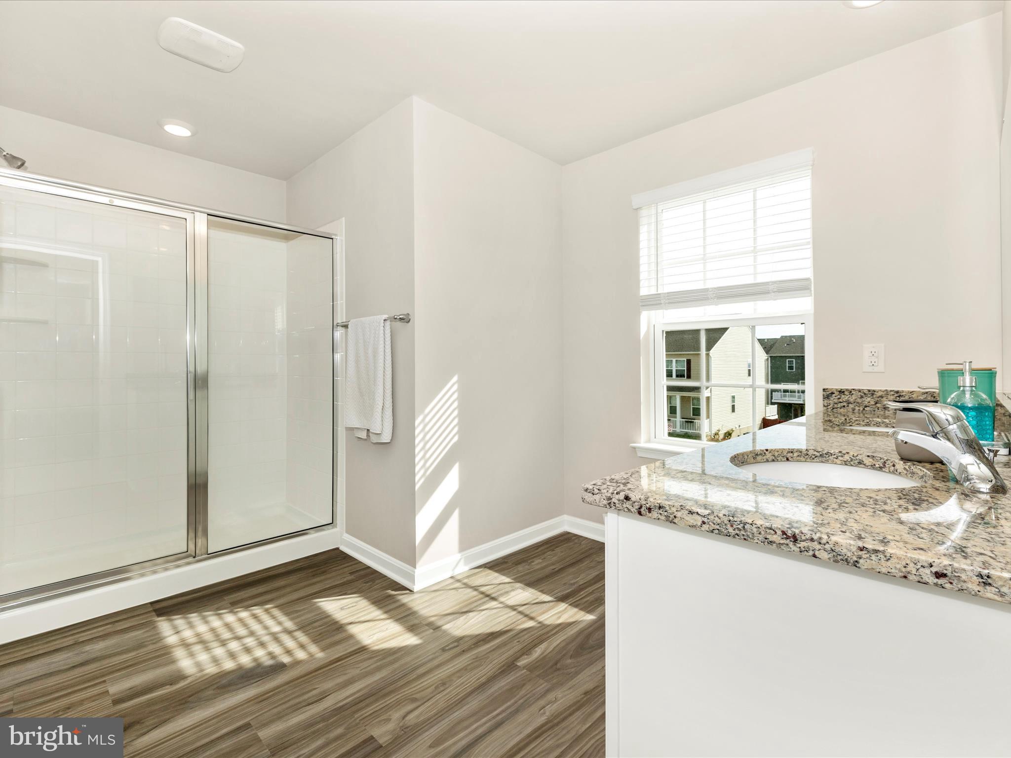 2088 Pomona Way Frederick, MD 21702 - Photo 25 of 55 a bathroom with a granite countertop sink and a window
