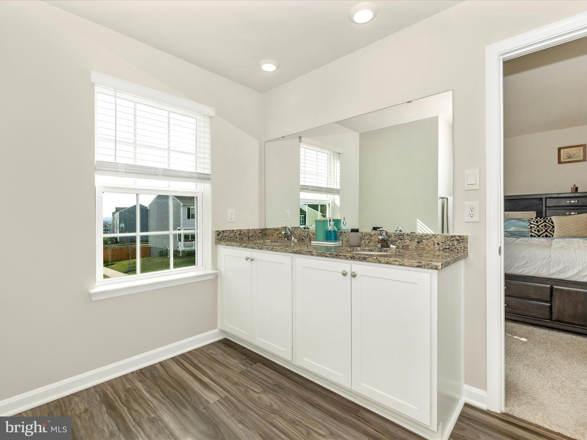 2088 Pomona Way Frederick, MD 21702 - Photo 26 of 55 a bathroom with granite countertop a sink and a window