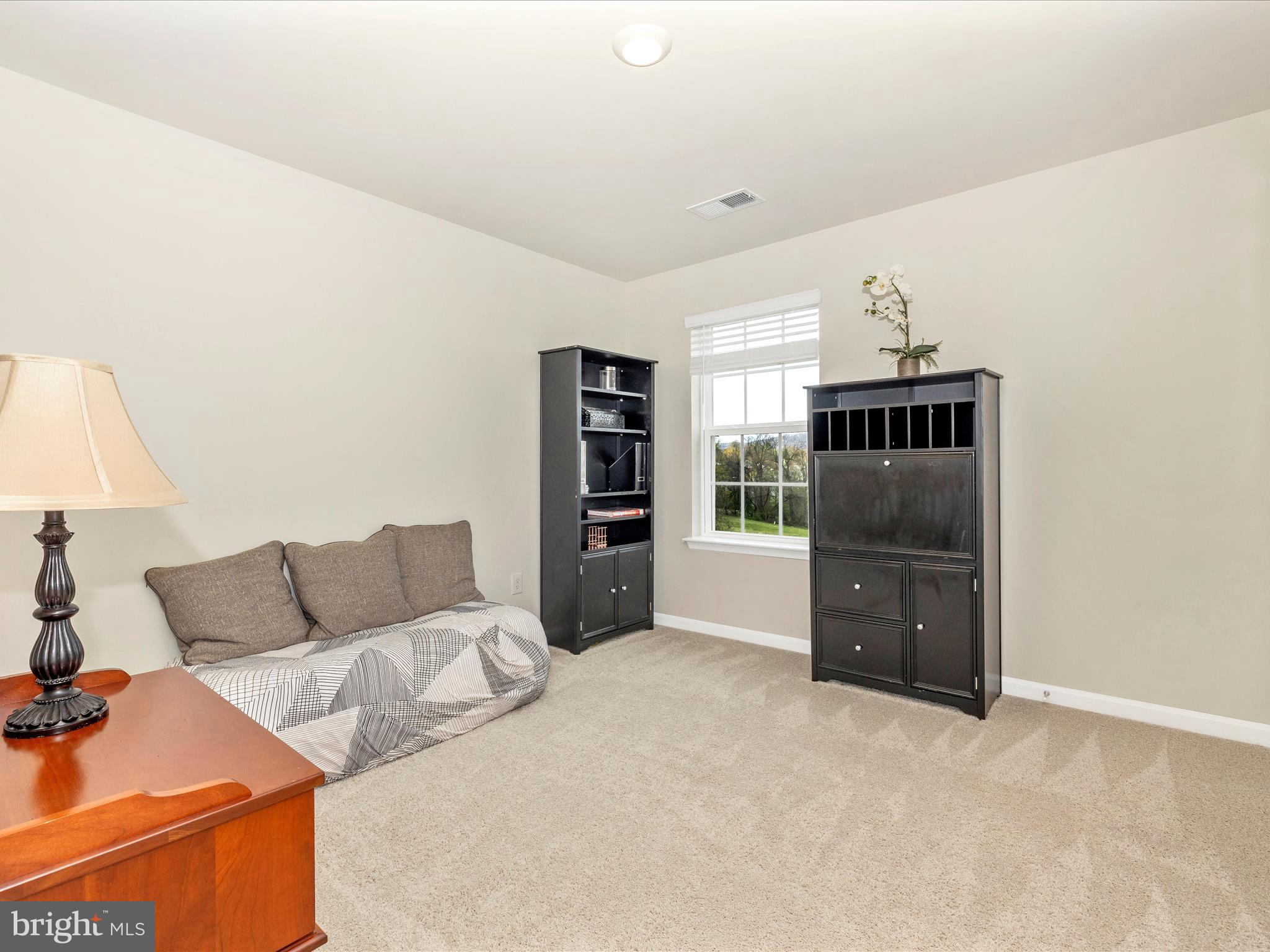 2088 Pomona Way Frederick, MD 21702 - Photo 27 of 55 a living room with furniture and a window