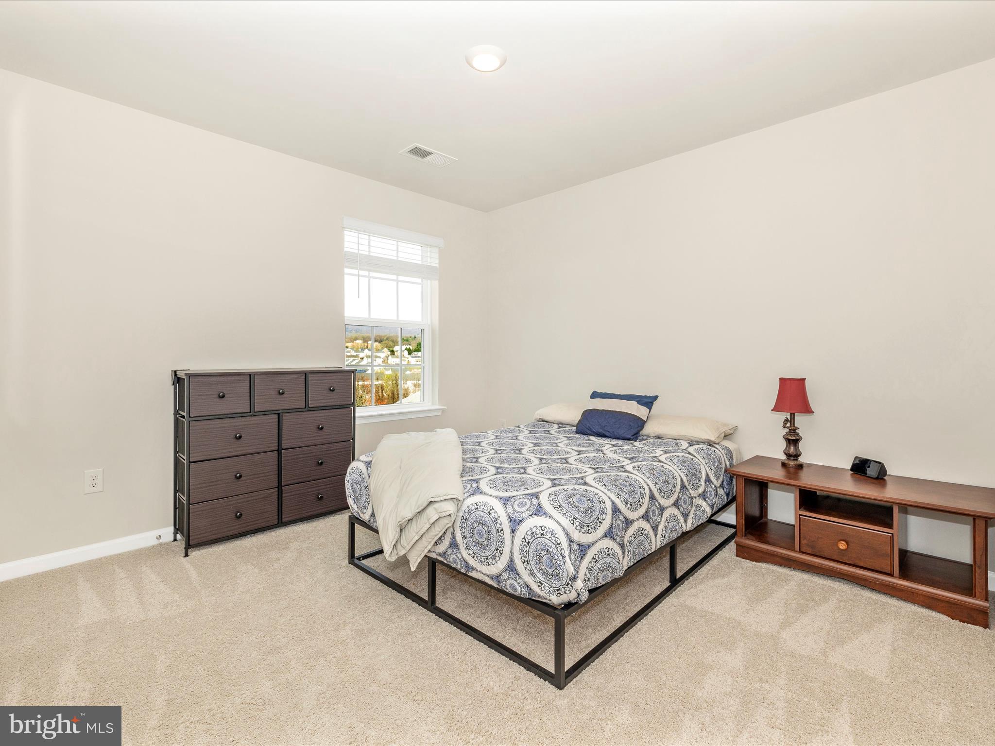 2088 Pomona Way Frederick, MD 21702 - Photo 29 of 55 a bedroom with a bed and dresser