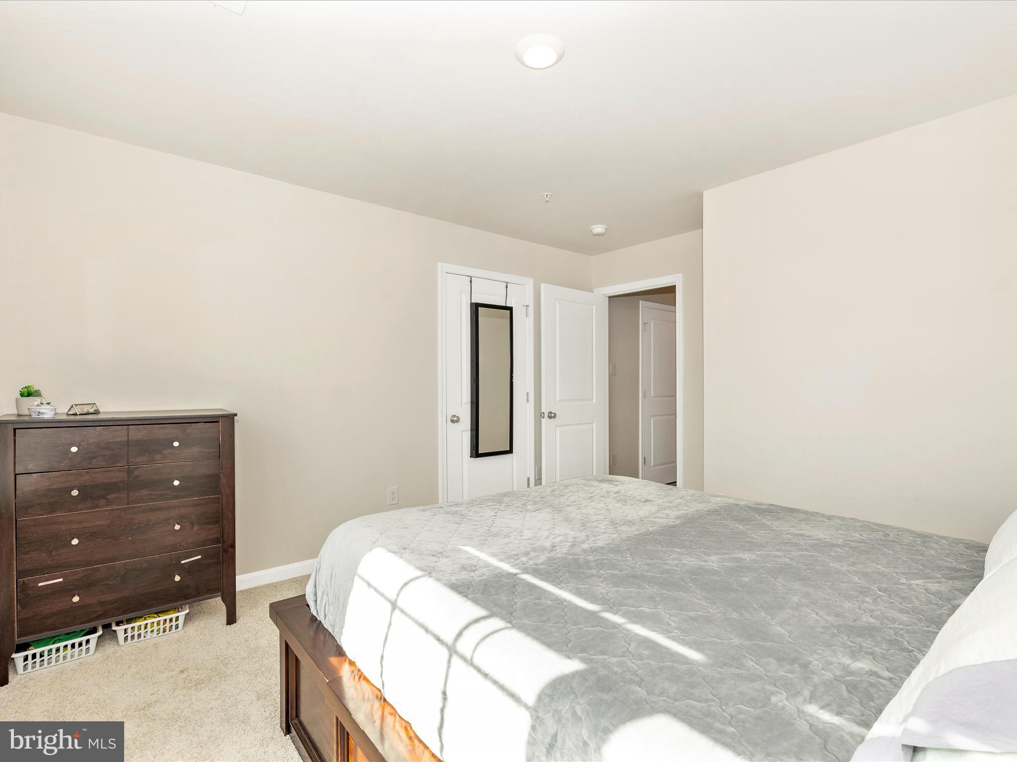 2088 Pomona Way Frederick, MD 21702 - Photo 32 of 55 a bedroom with a bed and a dresser