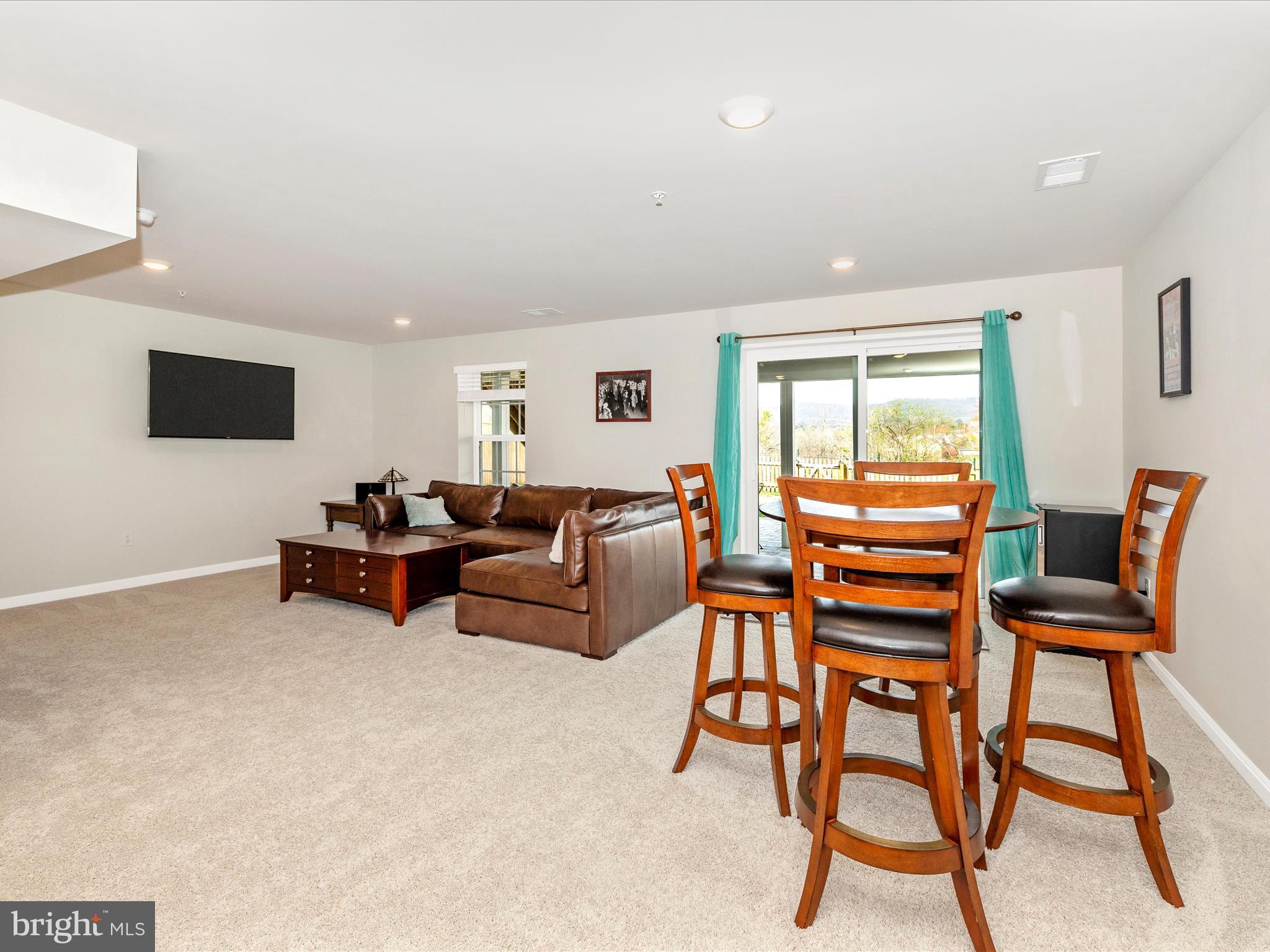 2088 Pomona Way Frederick, MD 21702 - Photo 39 of 55 a living room with furniture and a flat screen tv