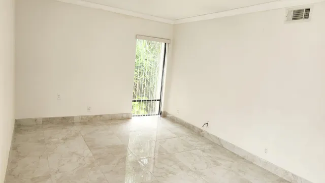 an empty room with windows