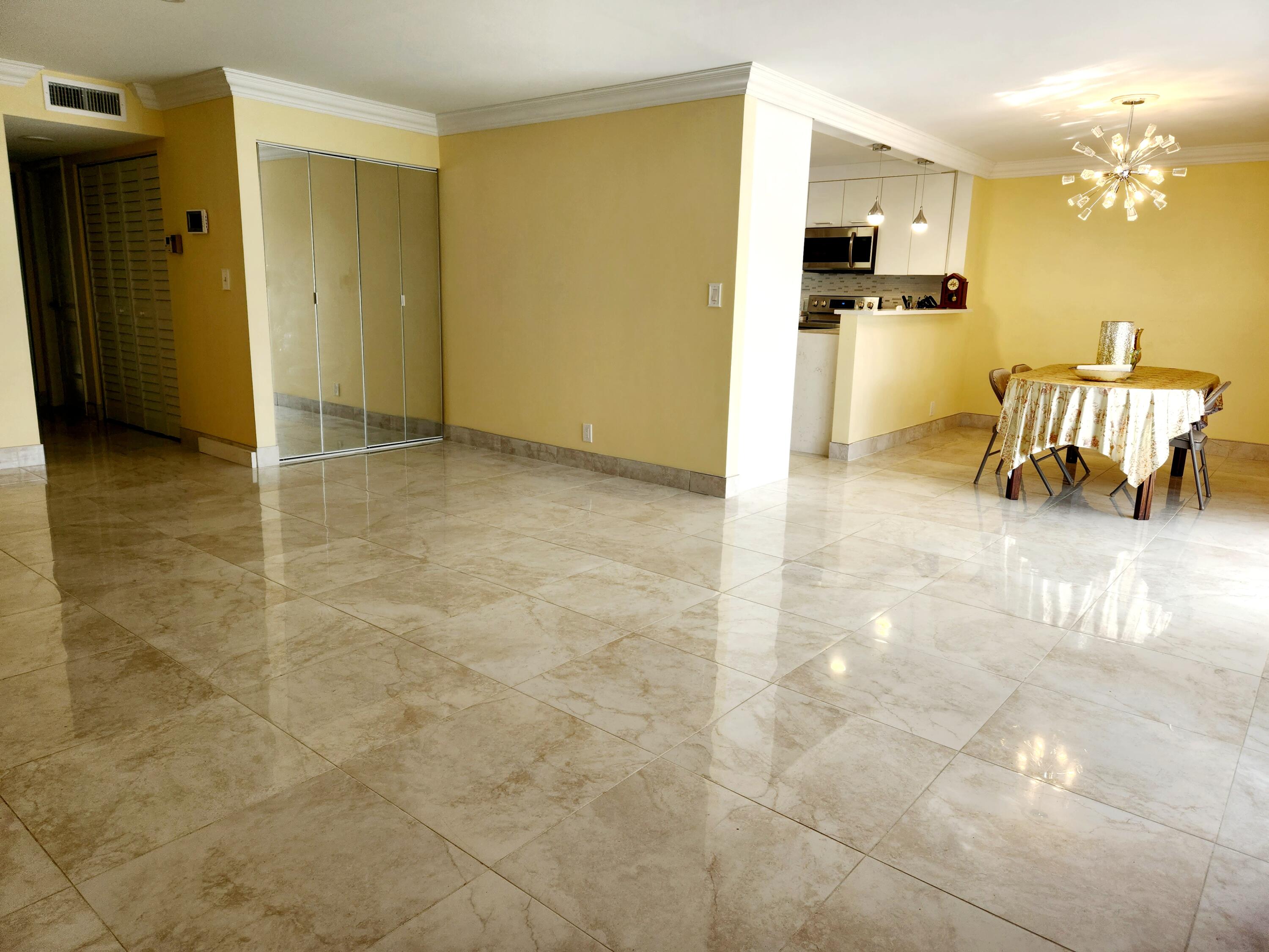 6557 Burning Wood Drive, Unit 215 Boca Raton, FL 33433 - Photo 5 of 22 a view of a living room and bathroom