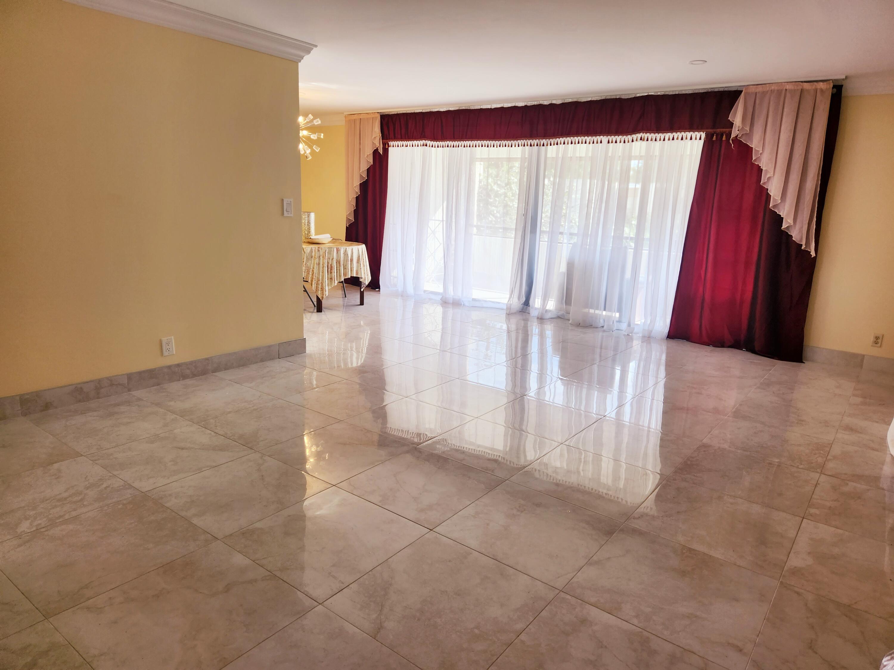 6557 Burning Wood Drive, Unit 215 Boca Raton, FL 33433 - Photo 7 of 22 a view of a room with a fireplace and a tub
