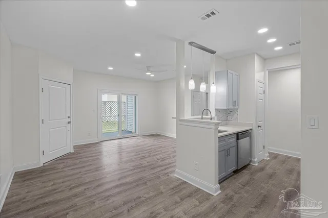 a stove top oven sitting inside of a kitchen