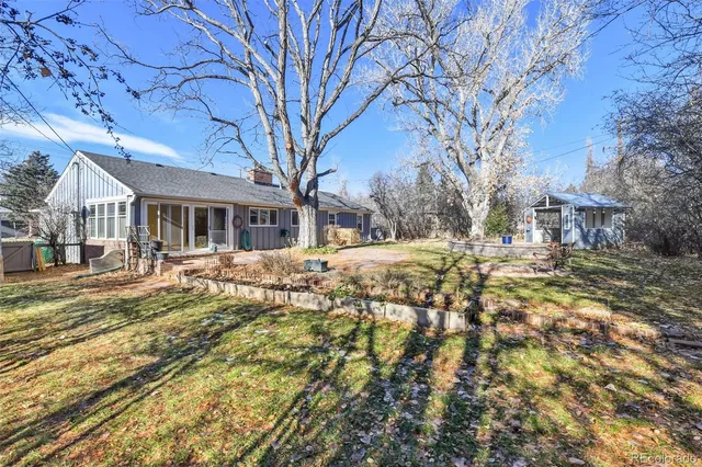 a view of house with snow on the road