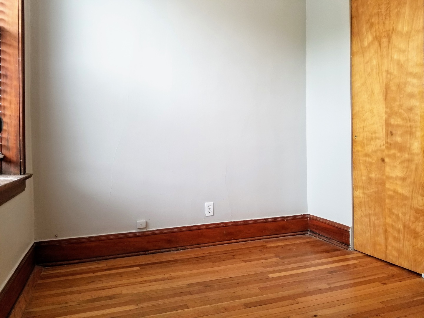 2152 West Iowa Street, Unit 1 Chicago, IL 60622 - Photo 9 of 10 a view of empty room with wooden floor and fan