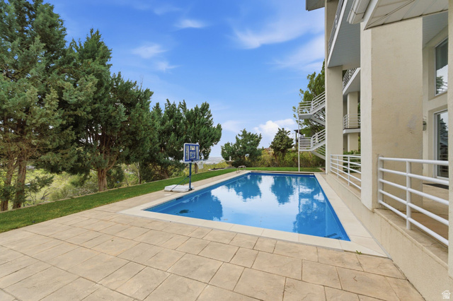 1878 East Ridge Point Drive Bountiful, UT 84010 - Photo 63 of 92 Swimming pool with a patio area and a lawn