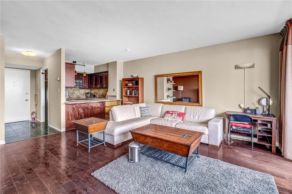 969 Hilgard Avenue, Unit 706 Los Angeles, CA 90024 - Photo 12 of 27 a living room with furniture and a rug
