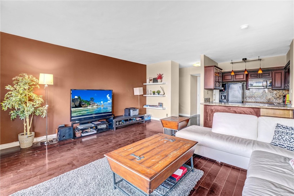 969 Hilgard Avenue, Unit 706 Los Angeles, CA 90024 - Photo 13 of 27 a living room with furniture and a flat screen tv