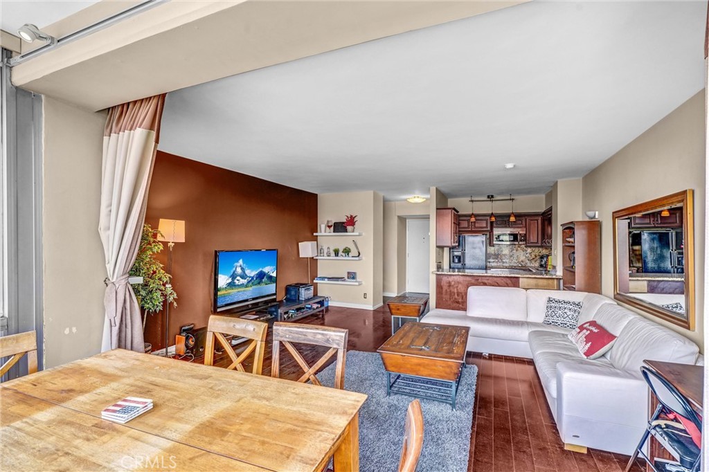 969 Hilgard Avenue, Unit 706 Los Angeles, CA 90024 - Photo 15 of 27 a living room with furniture and a flat screen tv
